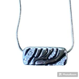 Lia Sophia silver and rhinestone zebra pendant on silver toned chain.